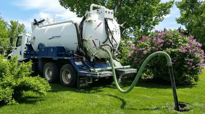 Professional vacuum truck performing residential drainage and septic maintenance in Ogden, UT
